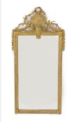 An early 19th century French gilt wood and gesso wall mirror, with ribbon, paterae and laurel leaf