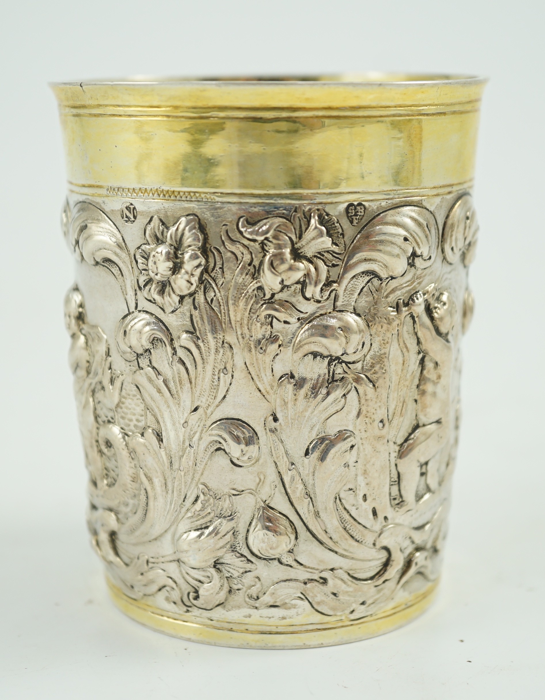 A late 18th century German embossed parcel gilt silver beaker, maker SBF, decorated with putti - Image 2 of 5
