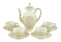 A Sevres reticulated part coffee set, early 20th century, finely pierced with six petal flower heads