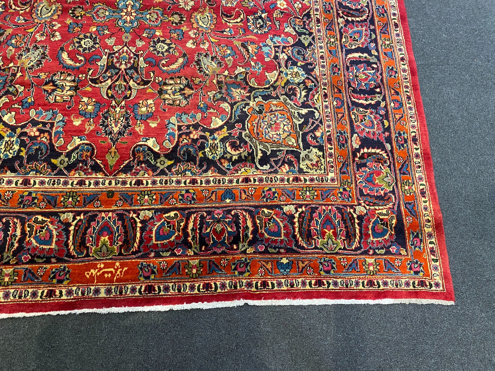 A Kashan claret ground carpet, woven with a central flowerhead medallion with palmettes and - Image 3 of 9