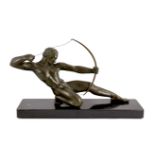 Salvator Riolo. An Art Deco patinated spelter figure of an archer, kneeling with bow string drawn