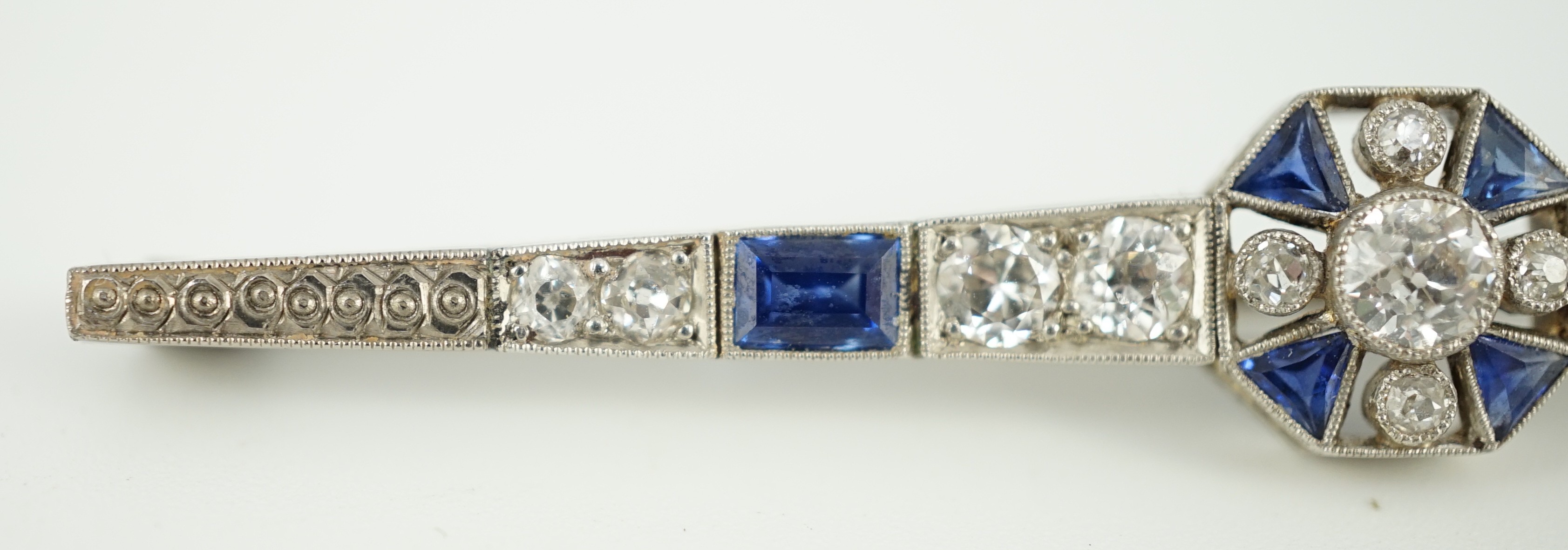 A 1920's/1930's white gold, sapphire and diamond cluster set bar brooch, with central octagonal - Image 3 of 6