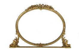 A Victorian giltwood and gesso overmantel mirror, of oval form with ribbon and flowers crest, beaded