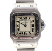 A lady's stainless steel Cartier Santos quartz wrist watch, on a stainless steel Cartier bracelet,