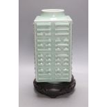 A Chinese celadon ‘eight trigrams’ vase, on stand. 32cm tall