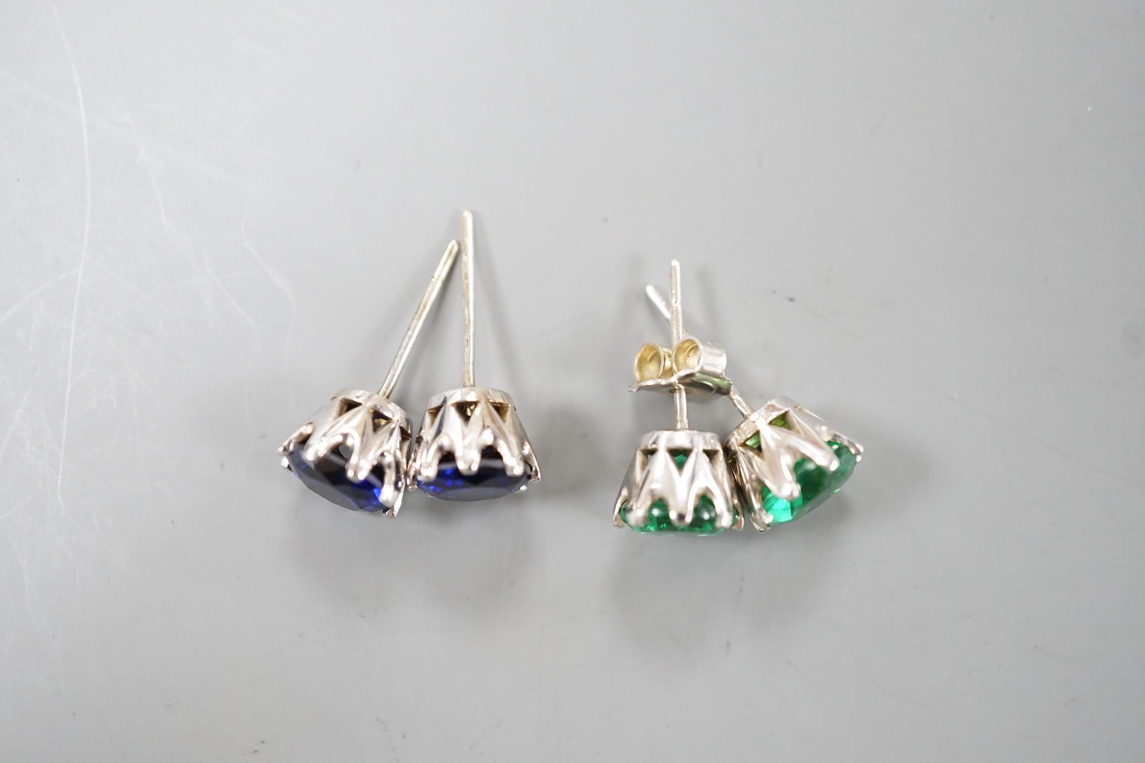 Two pairs of white metal ear studs, one set with green paste, the other with synthetic sapphires, - Image 2 of 2