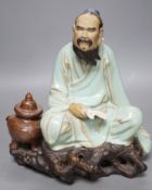 A Chinese Shiwan pottery figure. 23cm tall