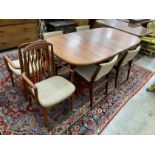 A mid century teak extending dining table, length 214cm extended, one spare leaf, width 108cm,