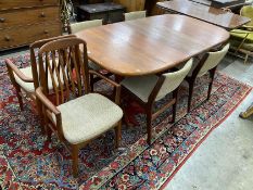 A mid century teak extending dining table, length 214cm extended, one spare leaf, width 108cm,