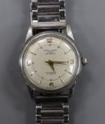 A gentleman's stainless steel Kendall and Dent Automatic Incabloc wrist watch, on associated steel