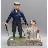 A carved and painted wood anti-Hitler caricature group, 47cm high