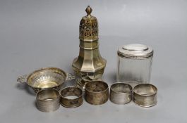 A George V silver sugar caster, London, 1933, 17cm, a silver topped glass toilet jar, a silver bon