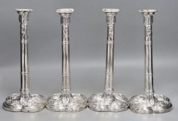 A set of four early George III silver gothic cluster column candlesticks, on cusped quatrefoil
