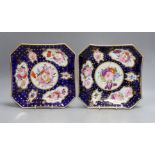 A pair of Coalport ground blue and gilt porcelain square dishes, c.1815-20, with floral panelled