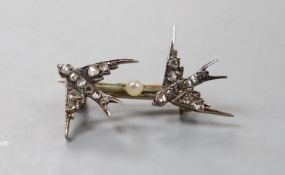A late Victorian yellow and white metal and rose cut diamond set twin swallow brooch, 27mm, gross