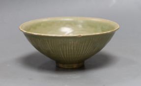 A Chinese carved Yaozhou celadon bowl, Northern Song Dynasty, 15.5cms high