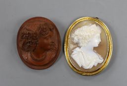 Two cameo brooches including yellow metal mounted cameo shell, carved with the bust of a lady to
