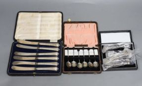 Three assorted cased sets including six silver handled tea knives, six bean end coffee spoons and
