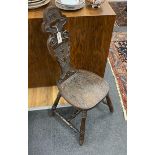 A Victorian carved oak spinning chair, by repute made from the timbers of HMS Foudroyant, dated