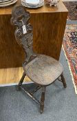 A Victorian carved oak spinning chair, by repute made from the timbers of HMS Foudroyant, dated