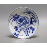 A Chinese blue and white ‘dragon’ plate. 17cm diameter