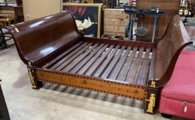 A reproduction Egyptian style inlaid gilt metal mounted mahogany sleigh bedframe, width 193cm,