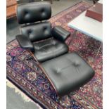 A pair of Eames style black leather, simulated rosewood swivel lounge chairs and footstools