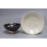 A Chinese Jizhou ‘scrolling leaf’ bowl, Song Dynasty, 11cm and a carved qingbai dish, 14cm