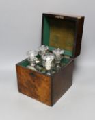 A Victorian burr walnut 4 bottle decanter box, four glass decanters and a silver ‘port’ label,