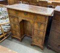 A George II feather banded walnut kneehole desk, length 99cm, depth 57cm, height 88cm
