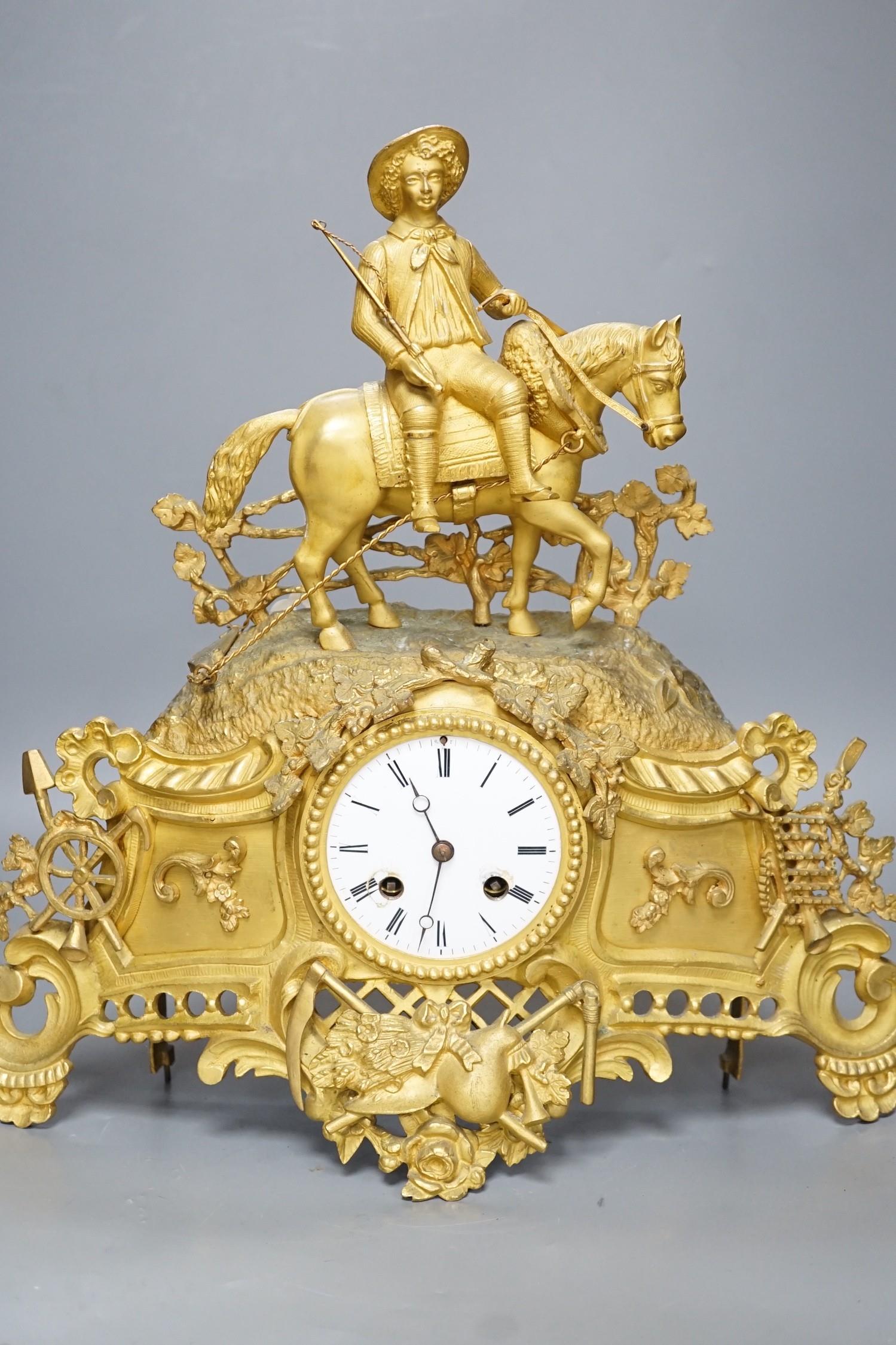 A Louis XV style gilt metal cased eight day mantel clock, 37cm tall