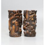 A pair of Chinese carved bamboo brush pots, late Qing dynasty, carved in high relief with a sage