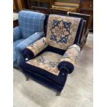 A Victorian saddlebag upholstered armchair, width 85cm, depth 92cm, height 97cm