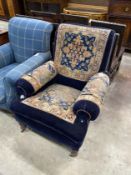 A Victorian saddlebag upholstered armchair, width 85cm, depth 92cm, height 97cm