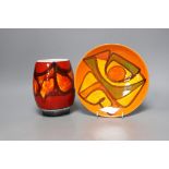 A Poole pottery orange and red abstract vase and plate, 20cm diameter