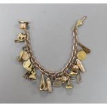 A 9ct charm bracelet, hung with assorted charms including two 9ct, silver and enamel, gilt metal and