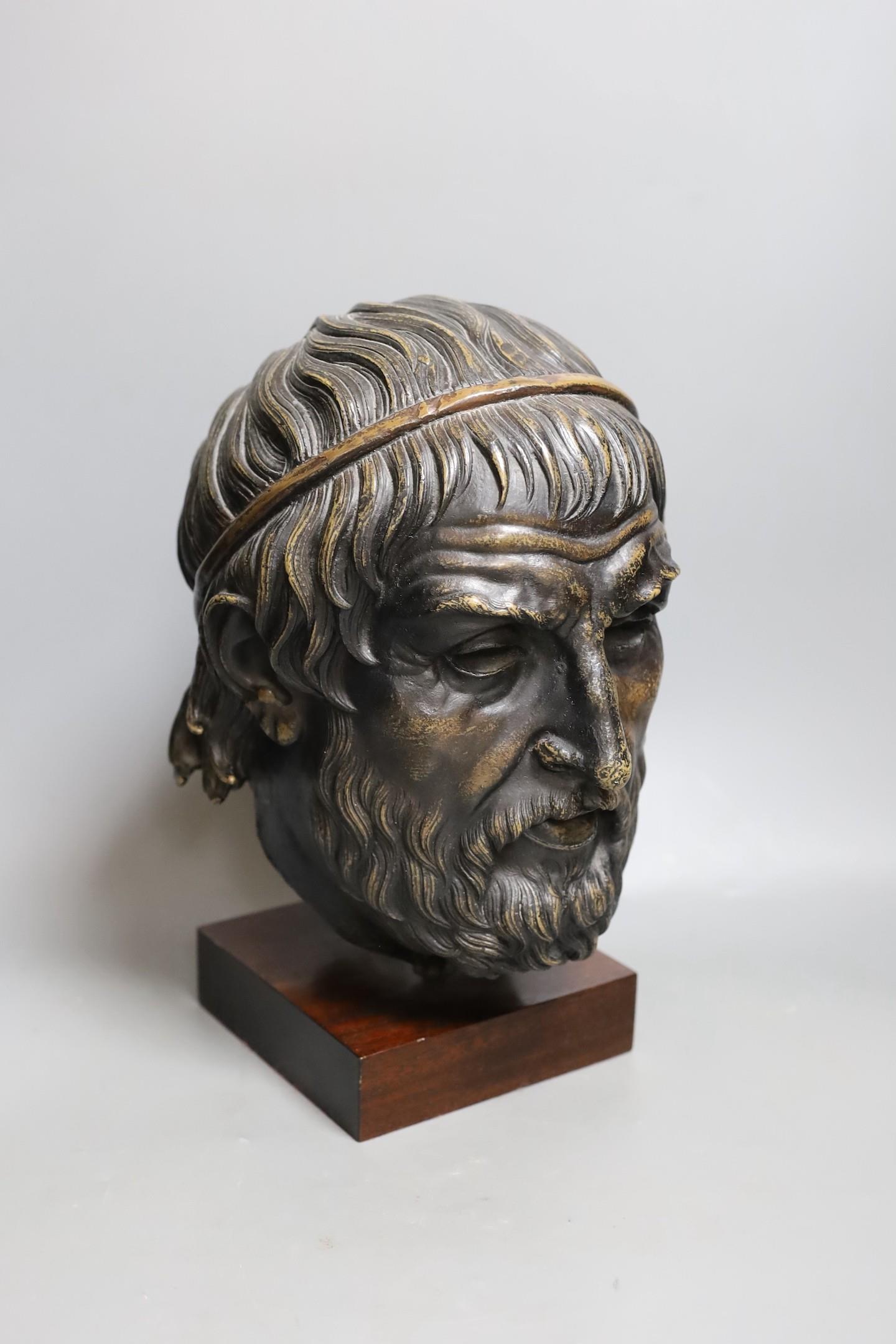 A bronzed composition figure of a classical head. 32cm tall