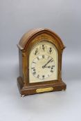 A George V inlaid walnut lancet shaped chiming mantel clock, with German movement and 15th July 1914