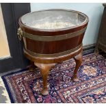 A George III style oval brass bound mahogany wine cooler on stand, width 60cm, depth 44cm, height