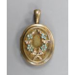 A late Victorian yellow metal, turquoise and seed pearl set oval locket, overall 48mm, gross