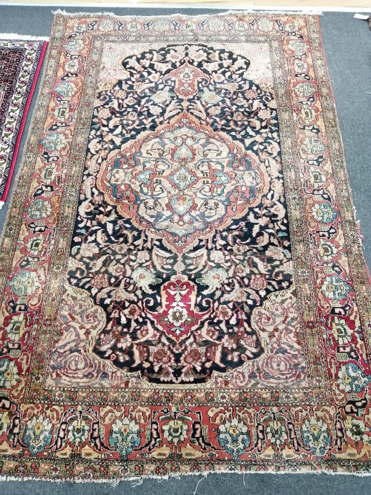 A North West Persian red ground rug, a Tabriz blue ground rug and two smaller modern rugs, largest - Image 2 of 4
