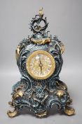 A Louis XV style spelter and parcel gilt mantel timepiece, 37cm