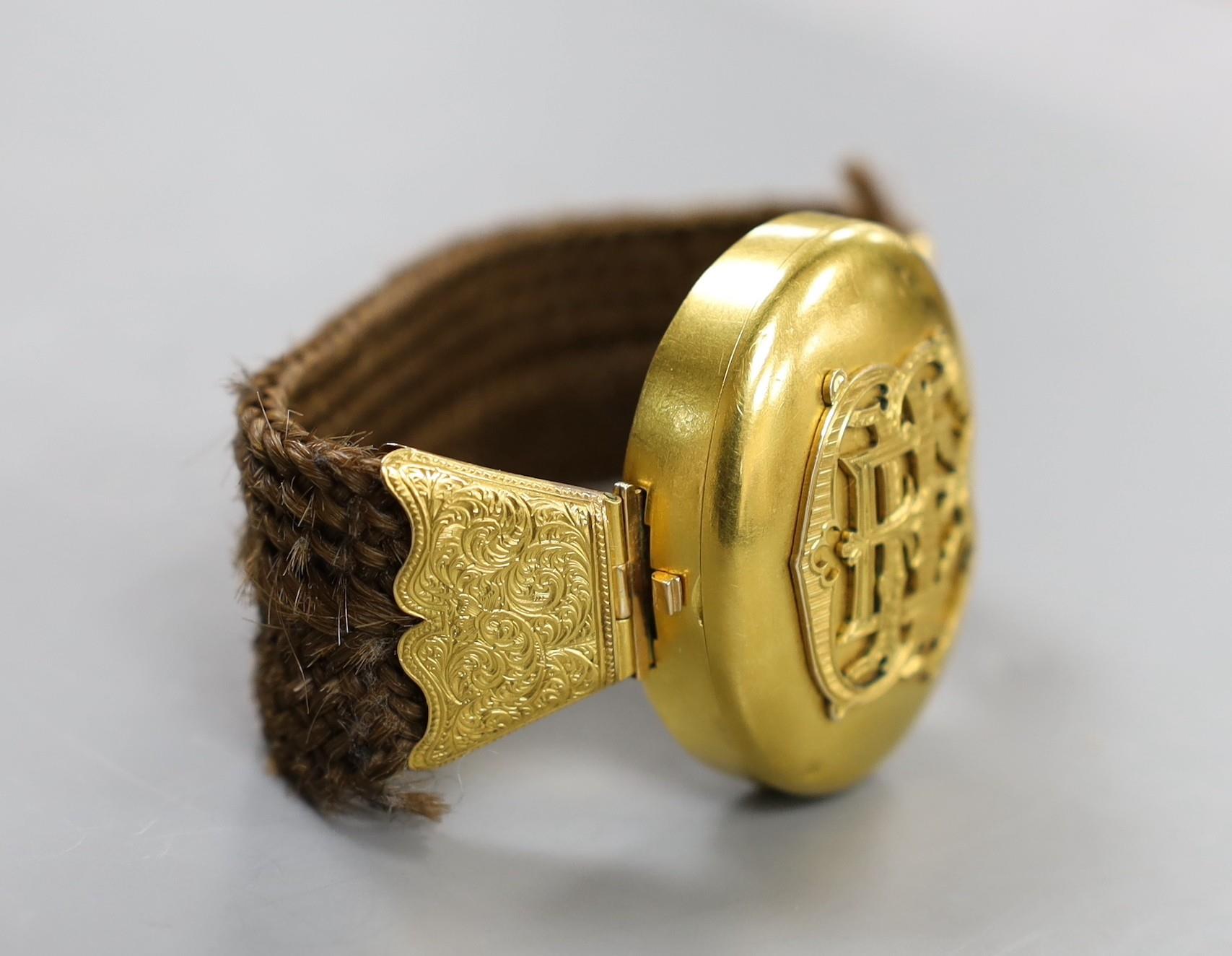 A Victorian yellow metal and hairwork bracelet with central photographic locket, central motif 44mm, - Image 2 of 3