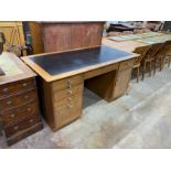 A mid century teak kneehole desk, length 152cm, depth 76cm, height 76cm