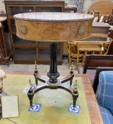 An early 20th century French gilt metal mounted part ebonised bird's eye maple oval work table,