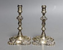 A pair of George V silver taper sticks, by Garrard & Co Ltd, London, 1934, 12.1cm, 10.7oz.