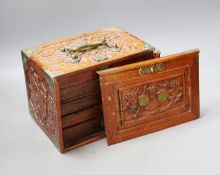 An early 20th century Chinese hardwood cased bone and bamboo mahjong set