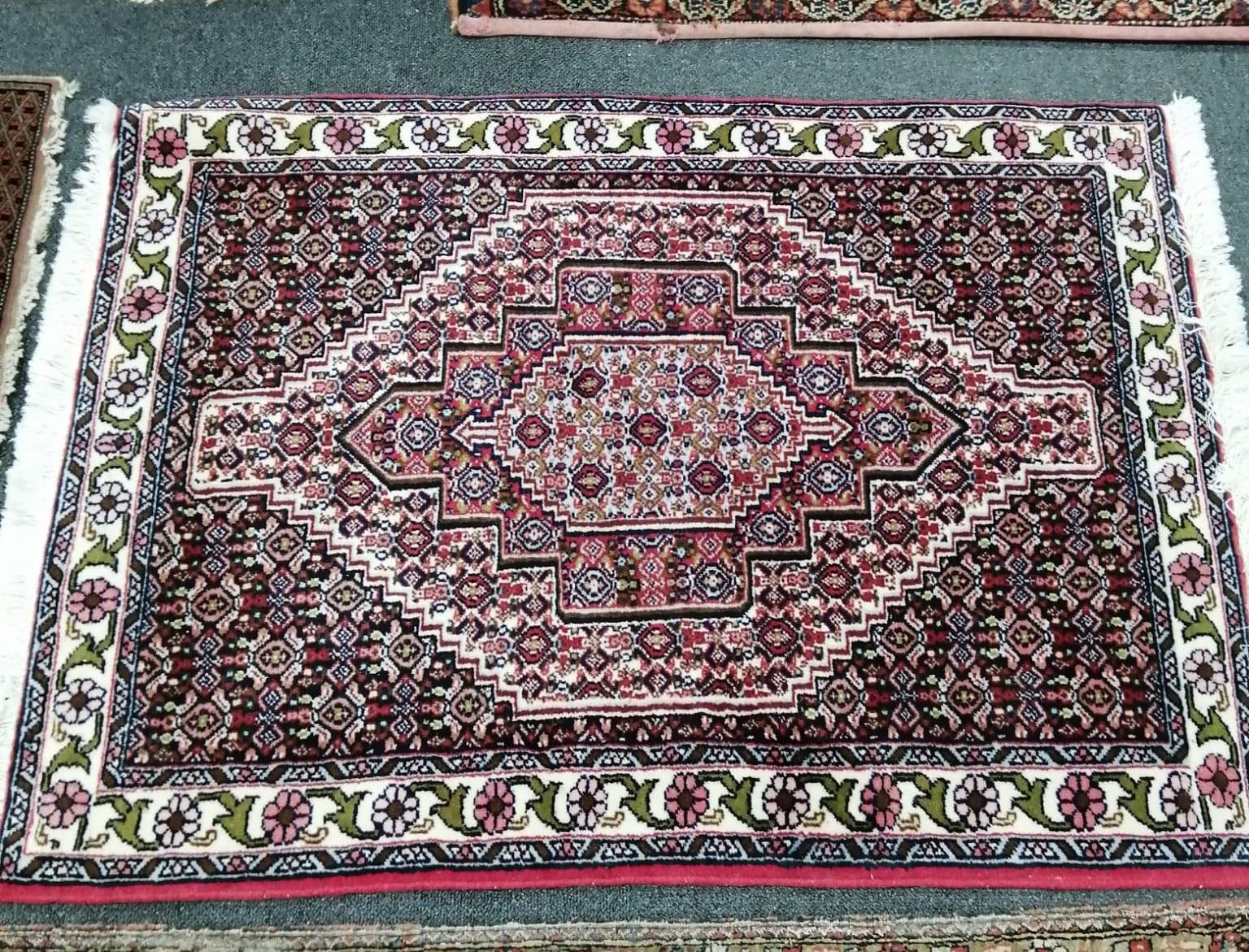 A North West Persian red ground rug, a Tabriz blue ground rug and two smaller modern rugs, largest - Image 4 of 4