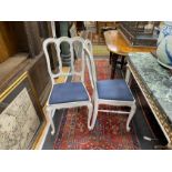 A set of four early 20th century Hepplewhite style painted dining chairs