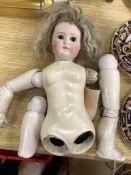 An early 20th century Lanternier & Cie, Limoges France bisque head doll, Cherie no. 11 and a another